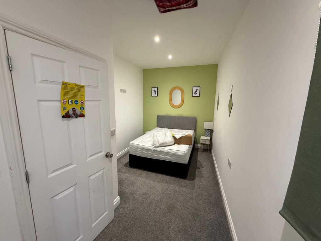 Lot: 100 - FREEHOLD MIXED COMMERCIAL AND RESIDENTIAL INVESTMENT - bedroom 2 from further towards the en-suite